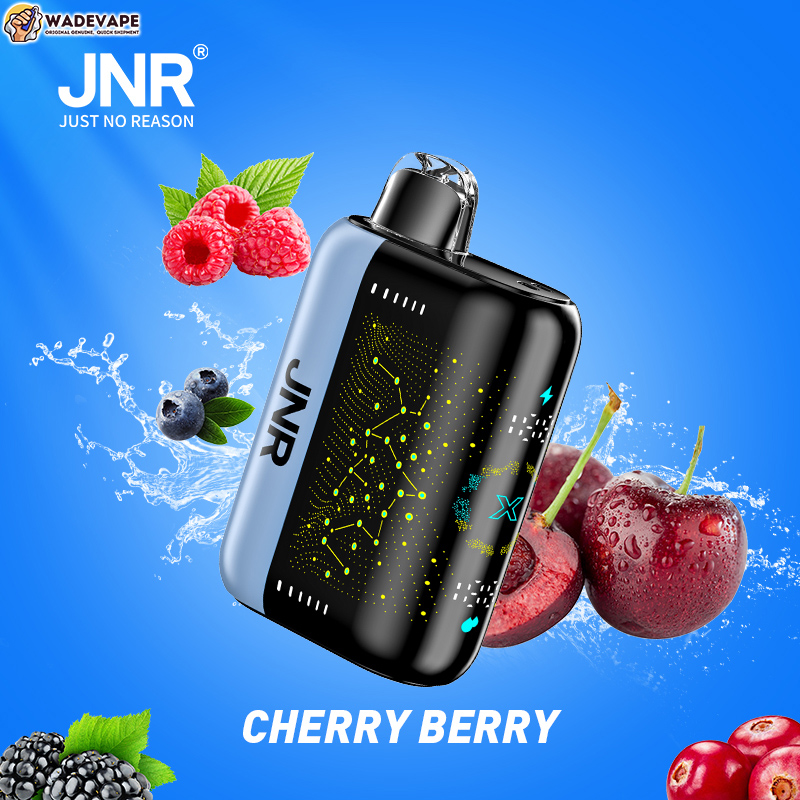 Compact black-and-silver JNR vape device with a glowing circuit-pattern panel and clear mouthpiece, set on a bright blue background with splashing water and scattered cherries, raspberries, blueberries and blackberries, plus JNR and WADEVAPE logos and the text CHERRY BERRY.