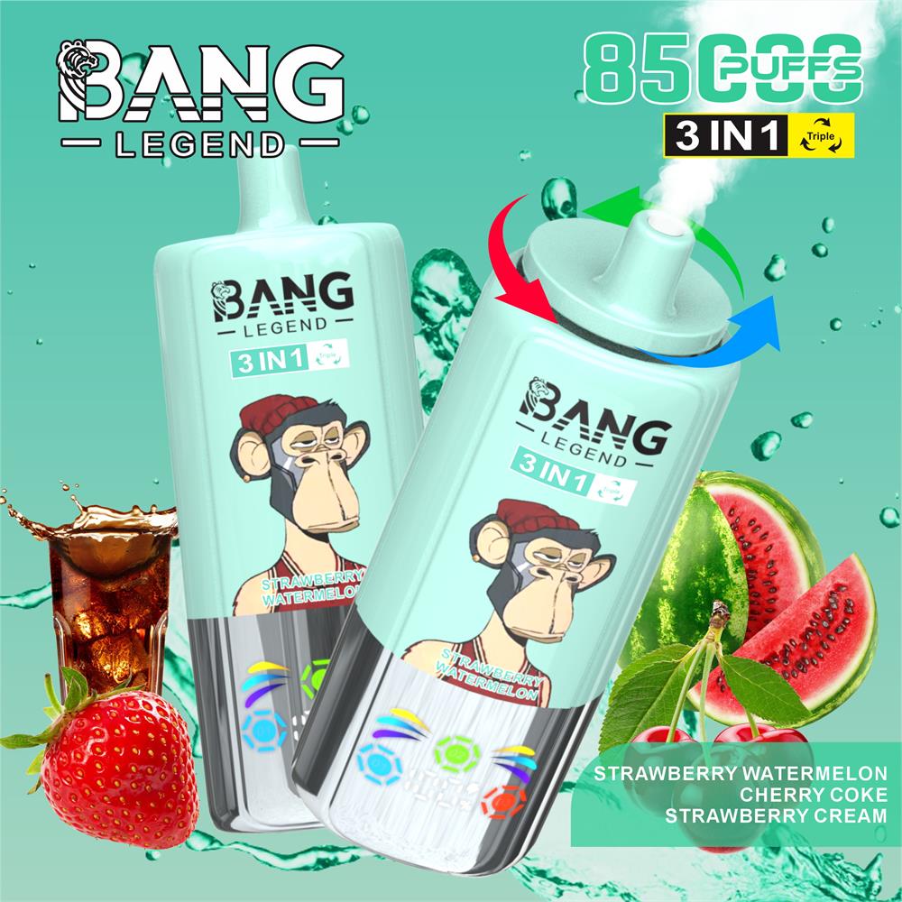 Mint-green Bang Legend 3‑in‑1 disposable vapes featuring a cartoon monkey logo and a rotating mouthpiece, shown against a teal background with splashing cola, strawberries and watermelon slices and flavour labels for strawberry, watermelon, cherry coke and strawberry cream.