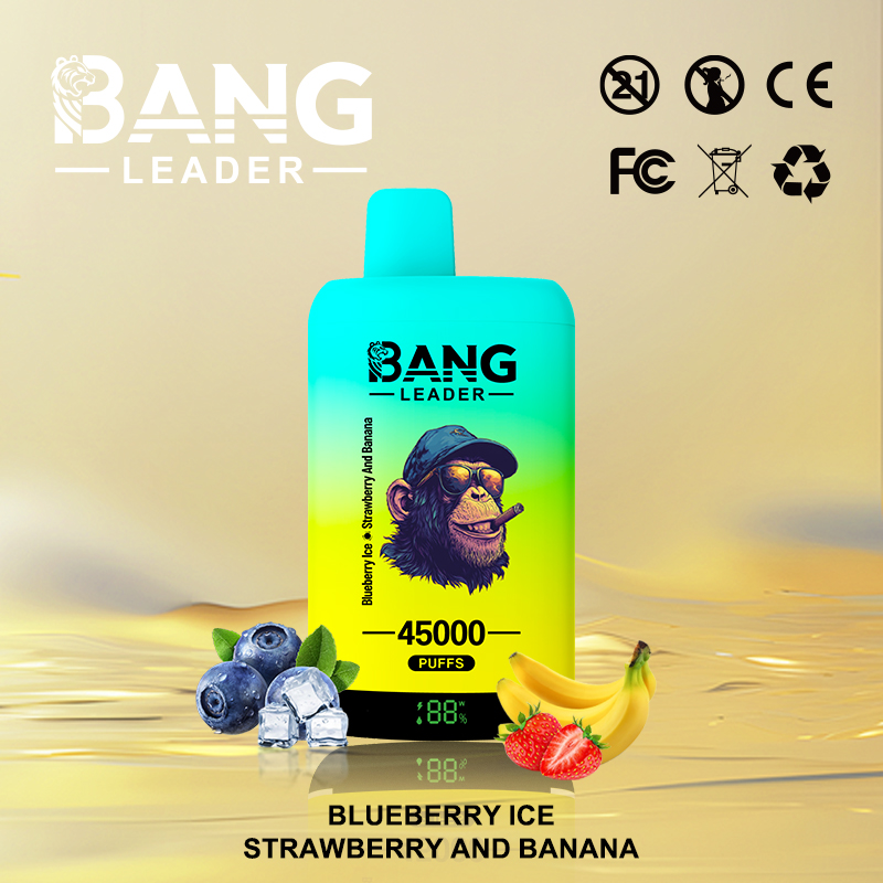 Bright turquoise-to-yellow disposable vape device labeled BANG LEADER featuring a sunglasses-wearing monkey illustration and '45000 puffs' text, shown with blueberries, ice cubes, a banana and strawberries on a reflective gold background with certification icons at the top right.