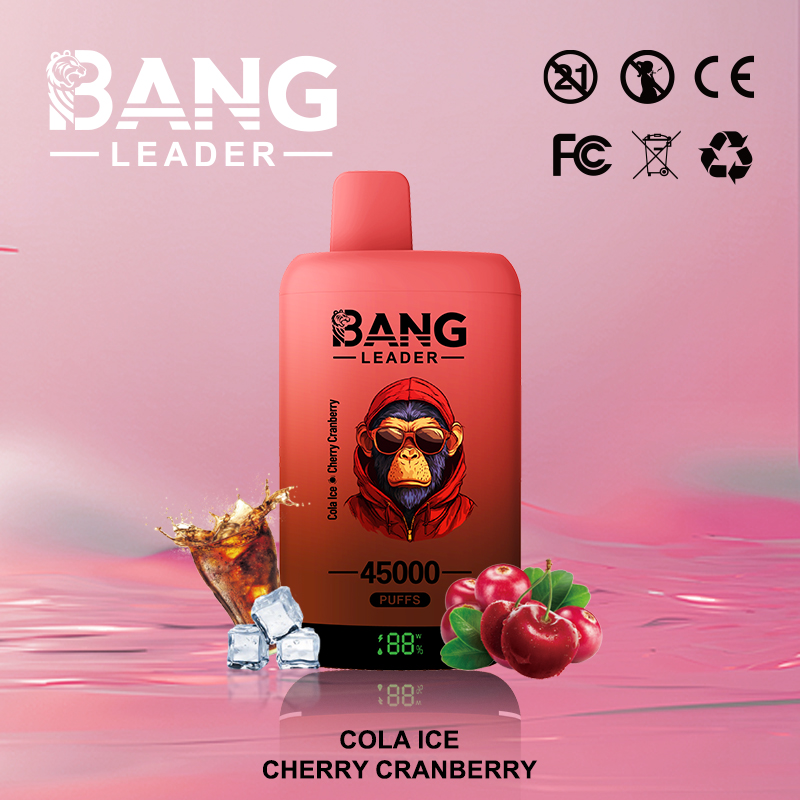 Red-orange disposable vape device labelled BANG LEADER with a hooded monkey wearing sunglasses and '45000 puffs' text, flavour 'Cola Ice Cherry Cranberry', shown on a pink background with a cola splash, ice cubes and cherries at its base and certification icons at the top-right.