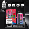 Colourful product image of a Bang King 30000 disposable vape and its box on a dark background, showing the crown logo, flavour Watermelon Ice Blueberry Mint with a colourful monkey illustration, feature icons for Type‑C charging, 550 mAh, 36 ml capacity and 1.0 Ω mesh coil, plus a prominent nicotine health warning.