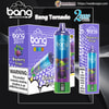 Purple-blue packaging and a metallic disposable vape branded 'Bang Tornado 20000 Puffs' (Blaze) in Blueberry Grape flavour, showing the cylindrical device with a green cartoon creature graphic, product boxes with blueberry artwork and a nicotine warning label.