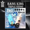 Promotional poster for Bang King Triple 85000 disposable vapes showing two cylindrical devices—one light blue with a cartoon monkey and one cream‑coloured with a different monkey illustration—floating against a smoky background with '3 in 1', '85 puffs' text, icons and the Bang King logo.