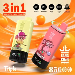 Advertising image of two cylindrical Bang King Vapen devices with cartoon monkey designs — a yellow 'Strawberry Red Bull' and a pink 'Strawberry Watermelon' — set against an orange swirled background with icons, a large '3 in 1' label and puff count text.