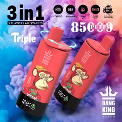 Two red Bang King disposable vape devices featuring stylised ape illustrations and small digital displays set against a swirling blue and purple smoke background, with prominent text indicating '3 in 1' and '85 puffs' and an adjustable three-flavour feature.