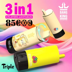 Advertisement showing three cylindrical Bang King Vapen 3-in-1 disposable vape devices—two cream-coloured and one bright yellow labelled 'strawberry watermelon'—laid over a wavy pastel background with bold pink '3 in 1', '3 flavors ajustables', '85 puffs' text and the Bang King logo.