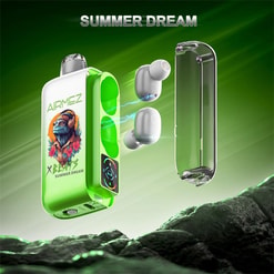 Bright neon‑green Airmez Summer Dream charging case decorated with a colourful bearded monkey wearing headphones and the X‑Beatz logo, shown open with its transparent lid removed and two white wireless earbuds floating beside it with blue charging sparks, set against a green gradient background above a rocky foreground.