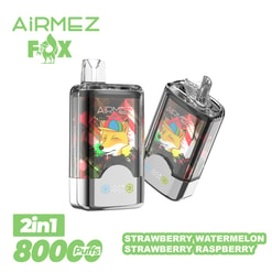 Two AiRMEZ Fox 2-in-1 disposable vape devices with colourful fox artwork, translucent mouthpieces and metallic bases, accompanied by green text reading '2in1 800 puffs' and flavour labels Strawberry, Watermelon and Strawberry Raspberry.