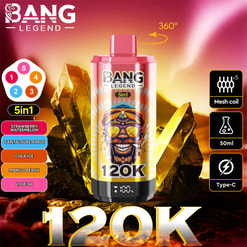 Jasnoróżowo-złote, cylindryczne urządzenie vape Bang Legend 5 w 1, oznaczone 120K, ustawione na tle świecącego kryształu i zachodu słońca, z próbkami smaków (Truskawkowy Arbuz, Jabłko Kantalupa, Cola Ice, Mango Peach, Love 66) po lewej stronie i ikonami po prawej stronie wskazującymi cewkę siatkową x5, pojemność 50 ml, ładowanie typu C i obrót o 360°.