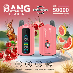 Two pink Bang Leader vape devices shown front and back with a digital display and colourful mascot graphic, surrounded by splashing cherries and grapefruit to indicate double flavours (cherry cola and pink lemonade) and labelled up to 50,000 puffs with Type‑C, 650mAh, dual‑mesh and adjustable icons.