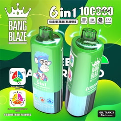 Two glossy green Bang Blaze 6‑in‑1 vape devices with transparent dual mouthpieces—one featuring a blue‑haired cartoon monkey and flavour icons—set against a bright green abstract background with labels indicating six adjustable flavours and a high puff count.