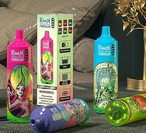 Three brightly coloured RandM Tornado disposable vape devices with bold cartoon artwork — pink, blue and multi‑coloured — arranged around the product box displaying feature icons and a nicotine warning, placed on a table in a living‑room setting with grey cushions and a decorative gold plant.
